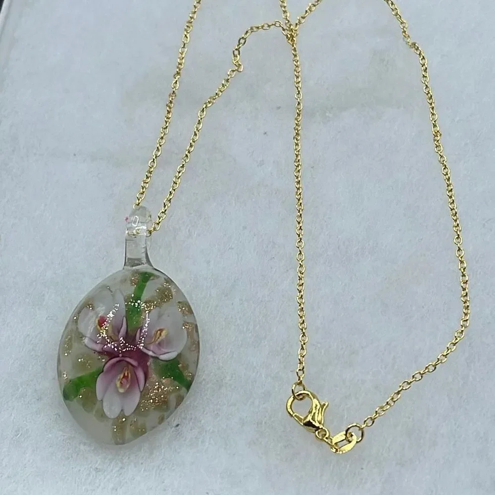 Floral art glass pendant on a 925 plated gold chain.